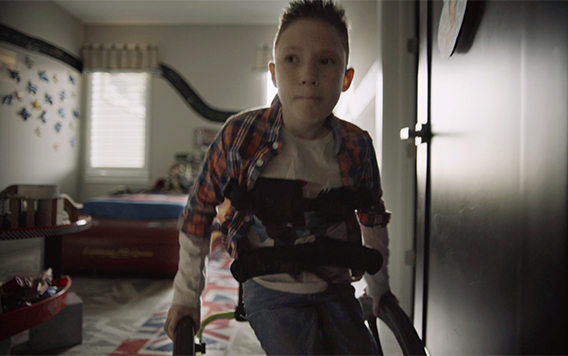 A boy in a walker learns that anything is possible with Jesus Christ