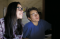 young woman and young man looking at computer screen