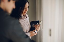 A woman holds the Book of Mormon