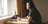 woman looking out window