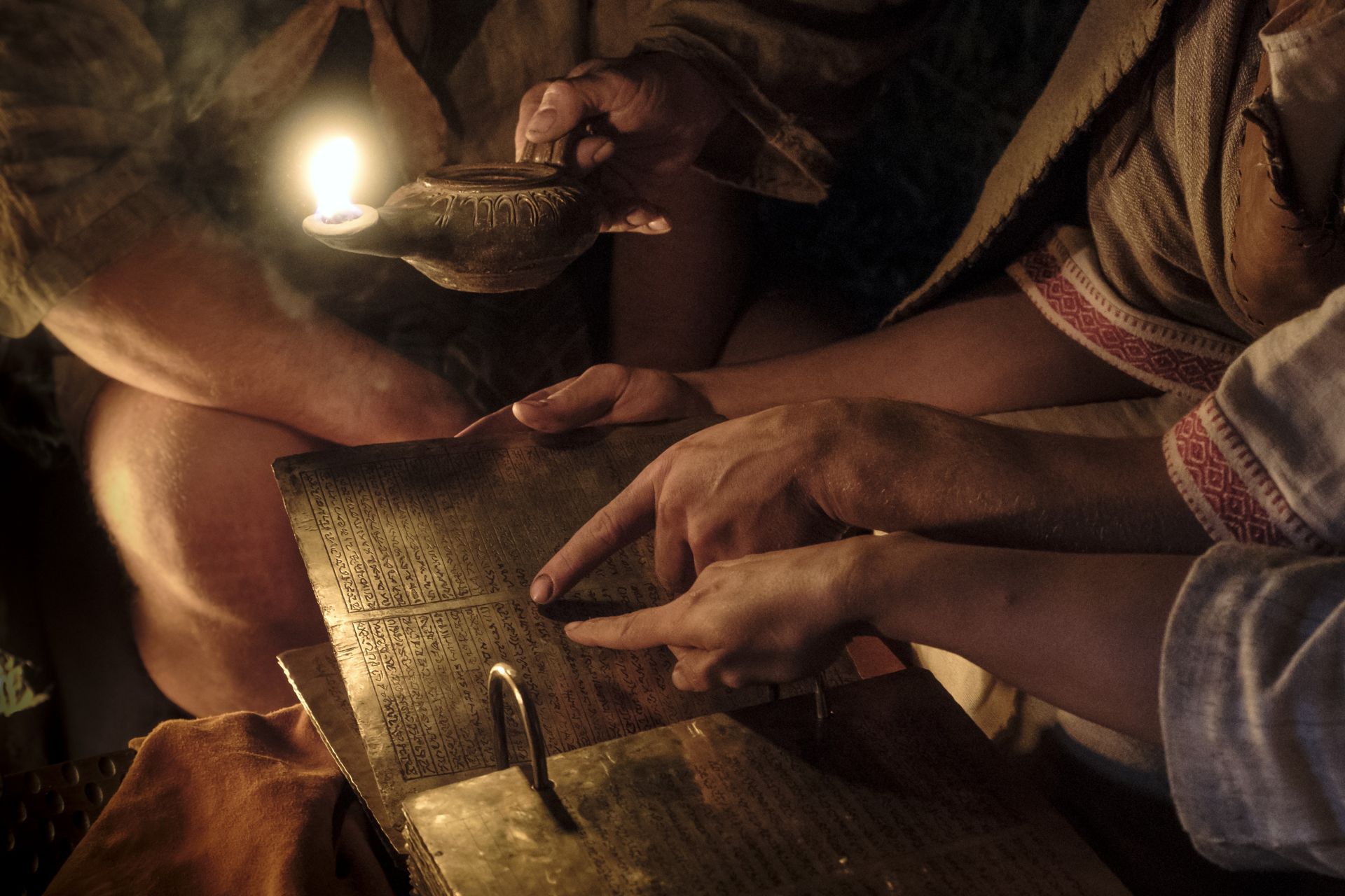 Lehi's family studies the brass plates