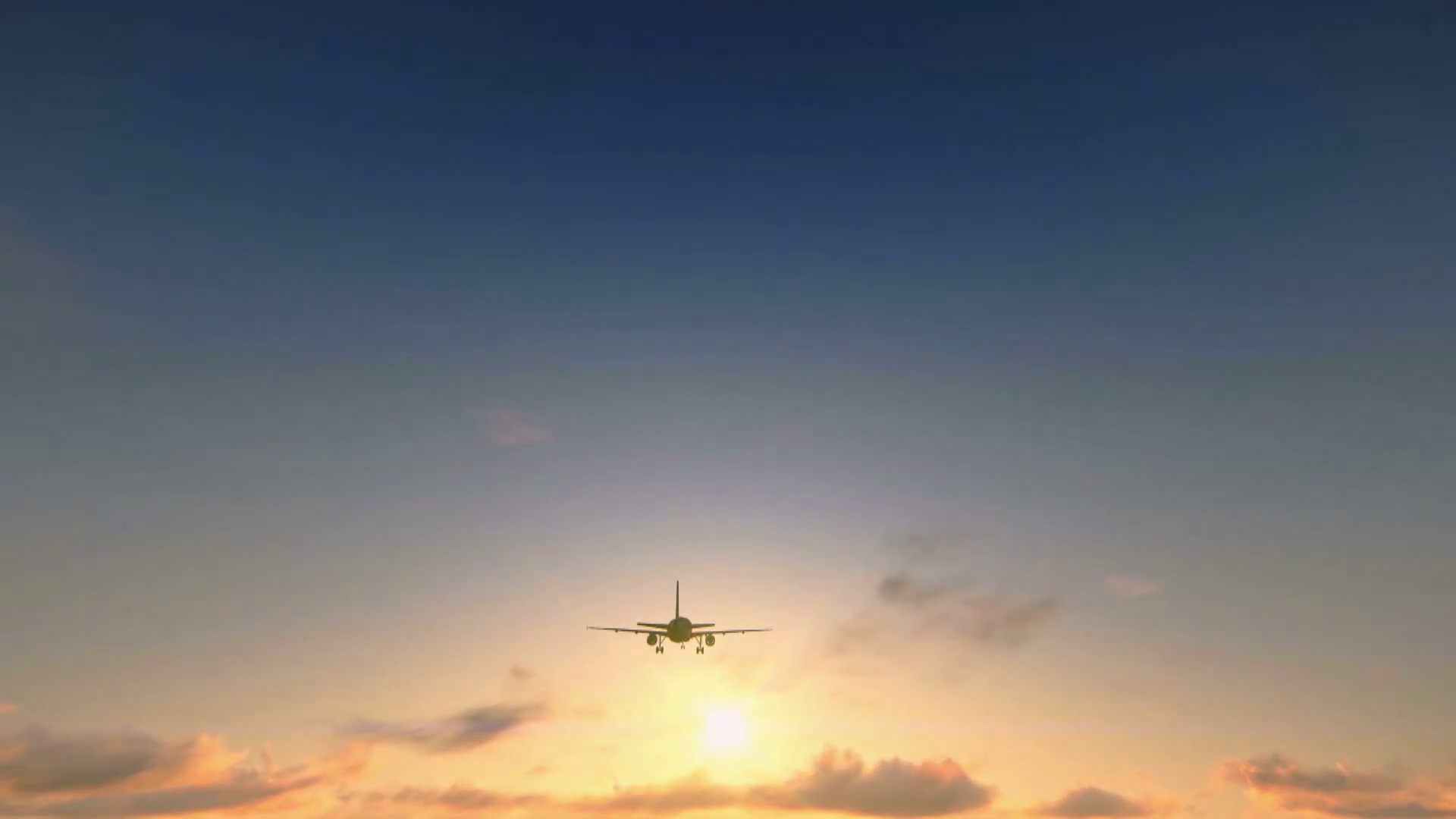 An image of an airplane in the sky during sunset.