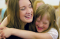 Primary Teacher hugging Girl
