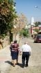 Elderly Couple Walking to Temple