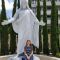 Woman with Statue of Christ