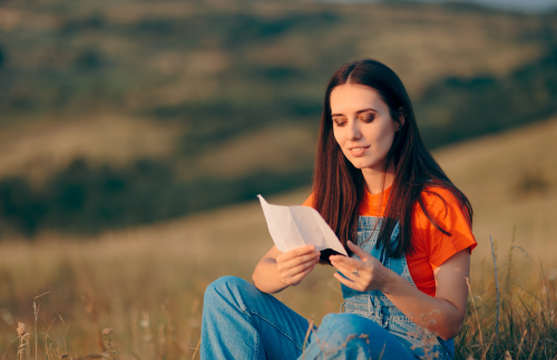 Young Woman Reading a Note