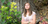 woman next to tree