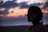woman looking at sunset