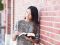 Young single adult reading her scriptures