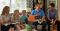 A family studying the Come Follow Me lesson.