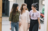 three young adults walking and laughing