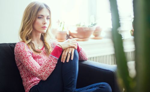 woman sitting thinking