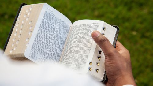 person reading scriptures