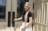 Young adult at temple doors
