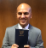 Girish Ghimire with Nepali Book of Mormon