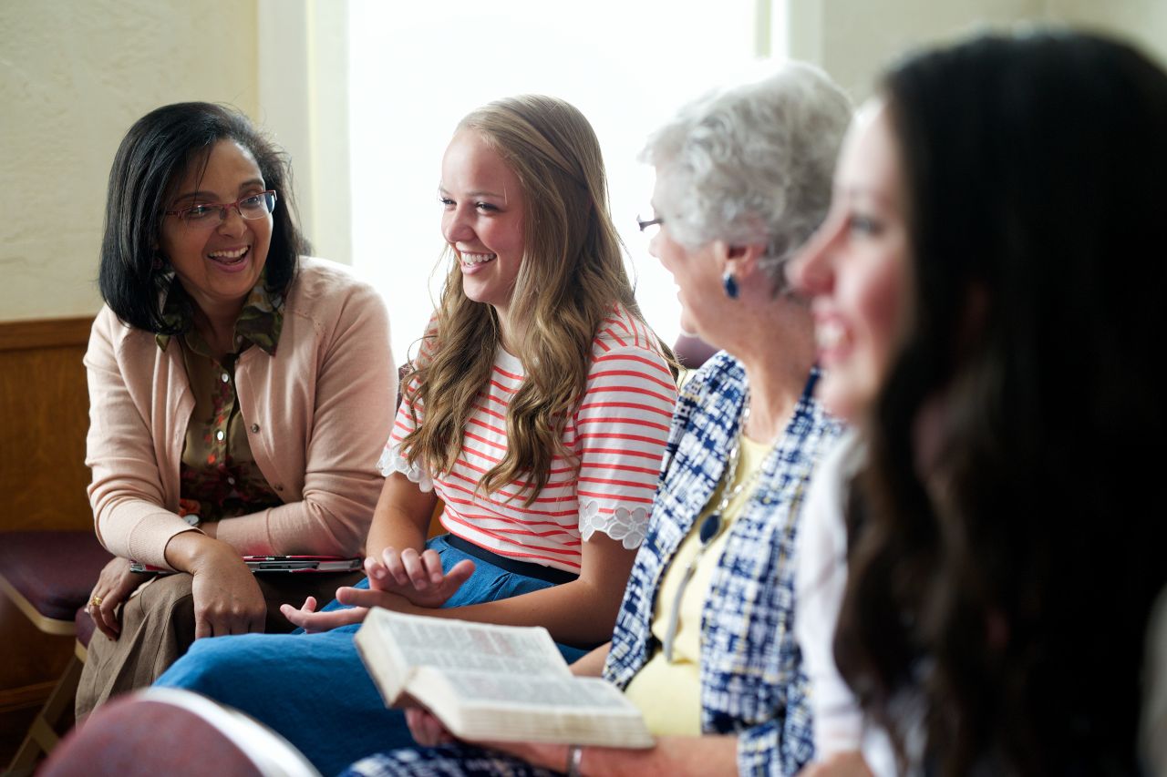 A group of women learn about the gospel of Jesus Christ during a Relief Society meeting