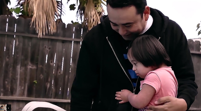 Erick teaches his young daughter about prayer