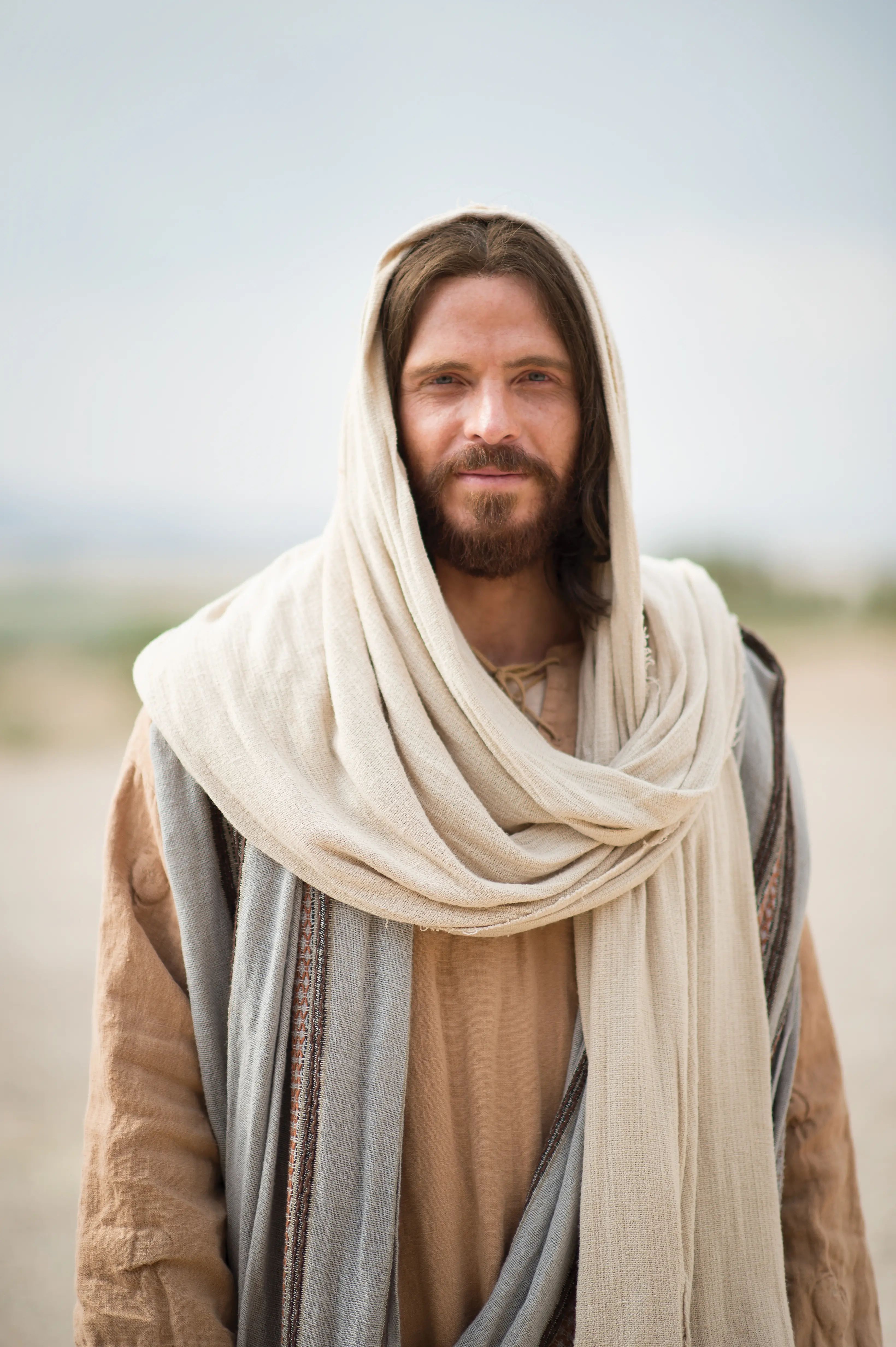 Portrait of Jesus Christ standing alone and smiling.