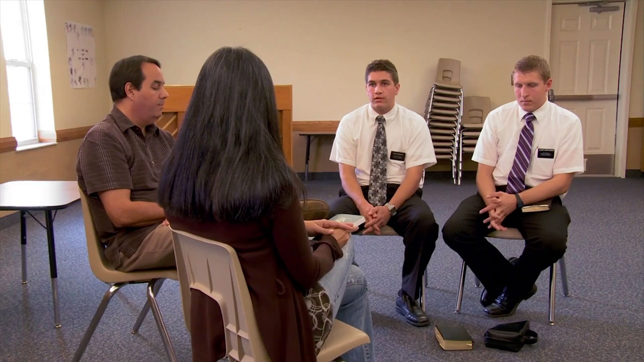 Two missionaries teaching