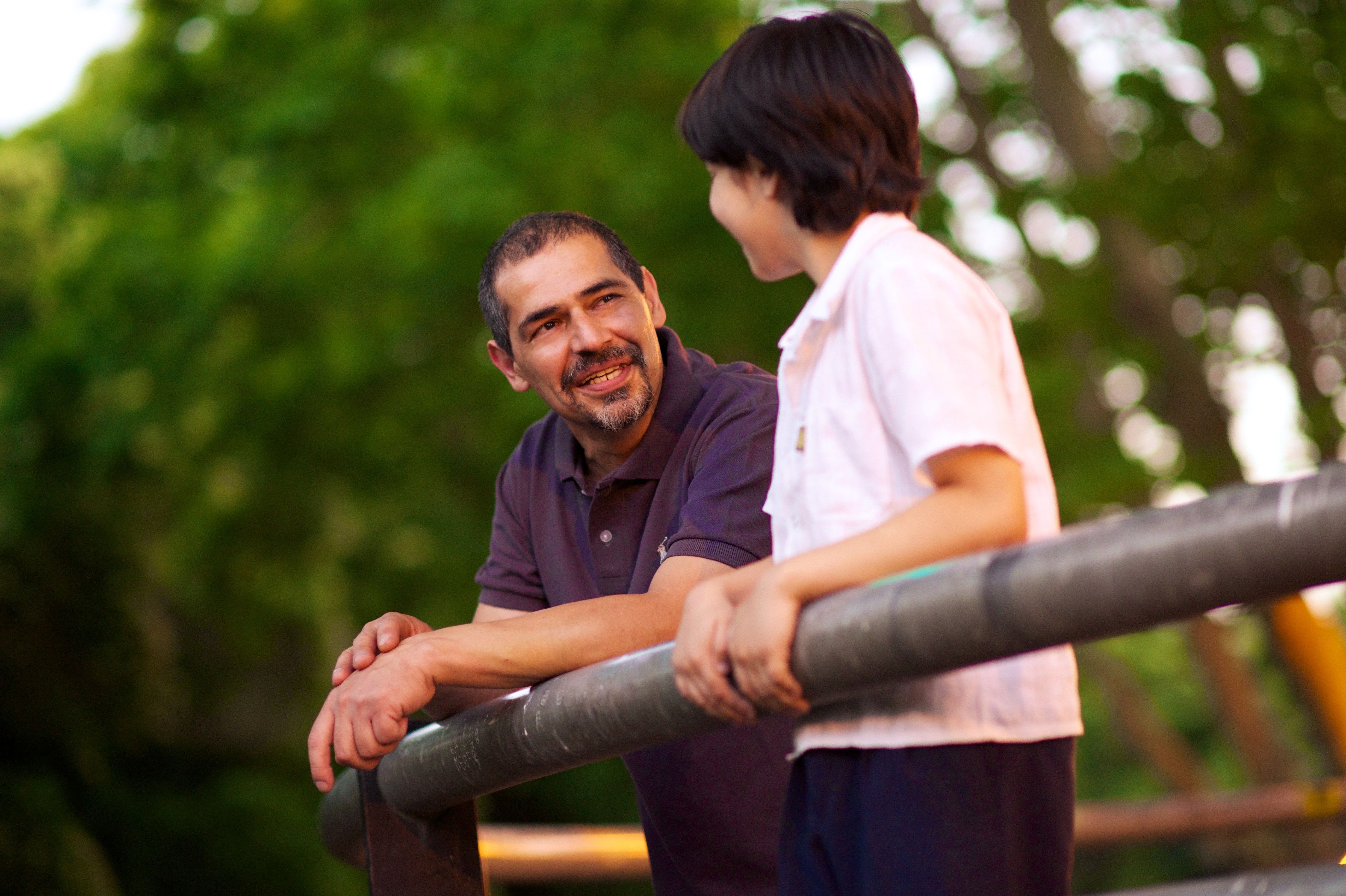 father and teenage son talking