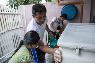 Family Washing a Car