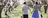 couple walking through trees