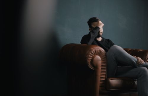 man sitting contemplating