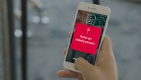 A young woman on her smartphone sends a message of comfort to a friend