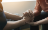 one person holding the hands of another