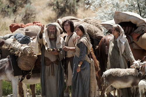 Lehi, Nephi, and Nephi's wife using the Liahona