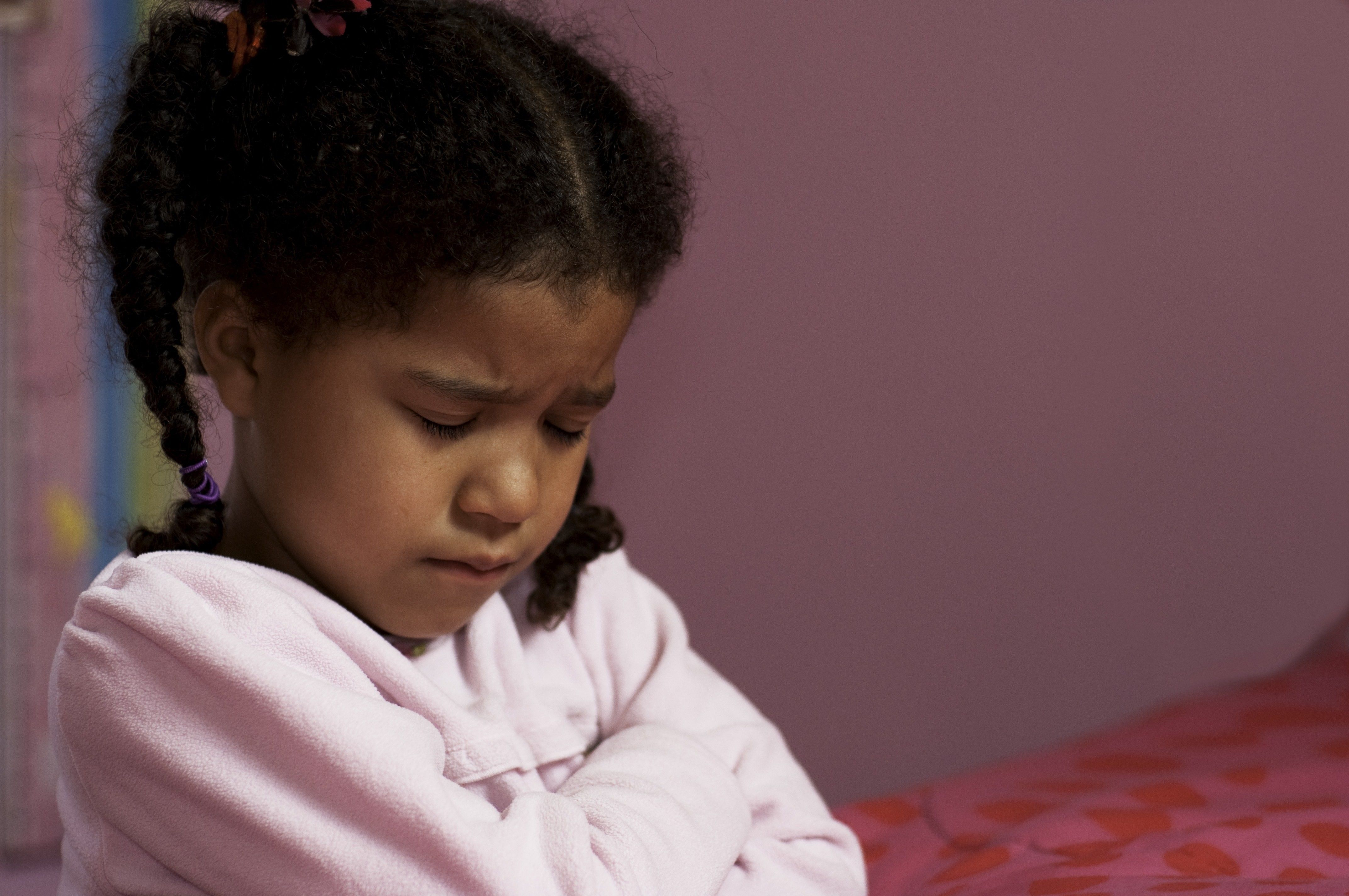 little girl praying in church