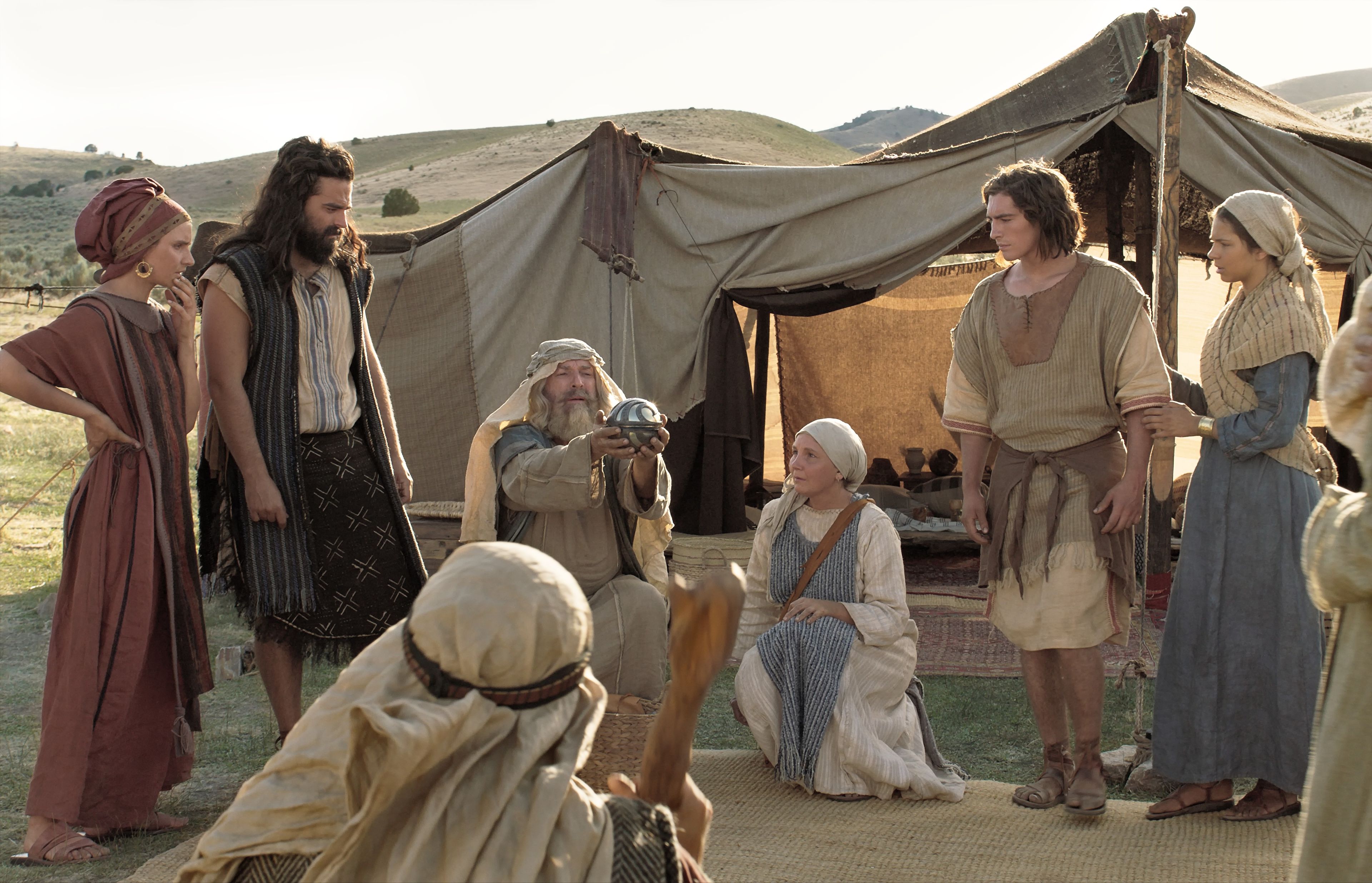 Lehi showing his family the Liahona Lehi showing his family the Liahona