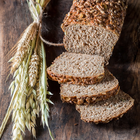 A loaf of bread and sheves of wheat