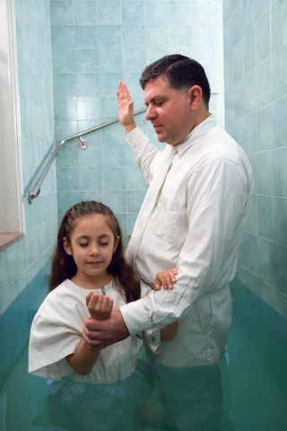 Girl Being Baptized