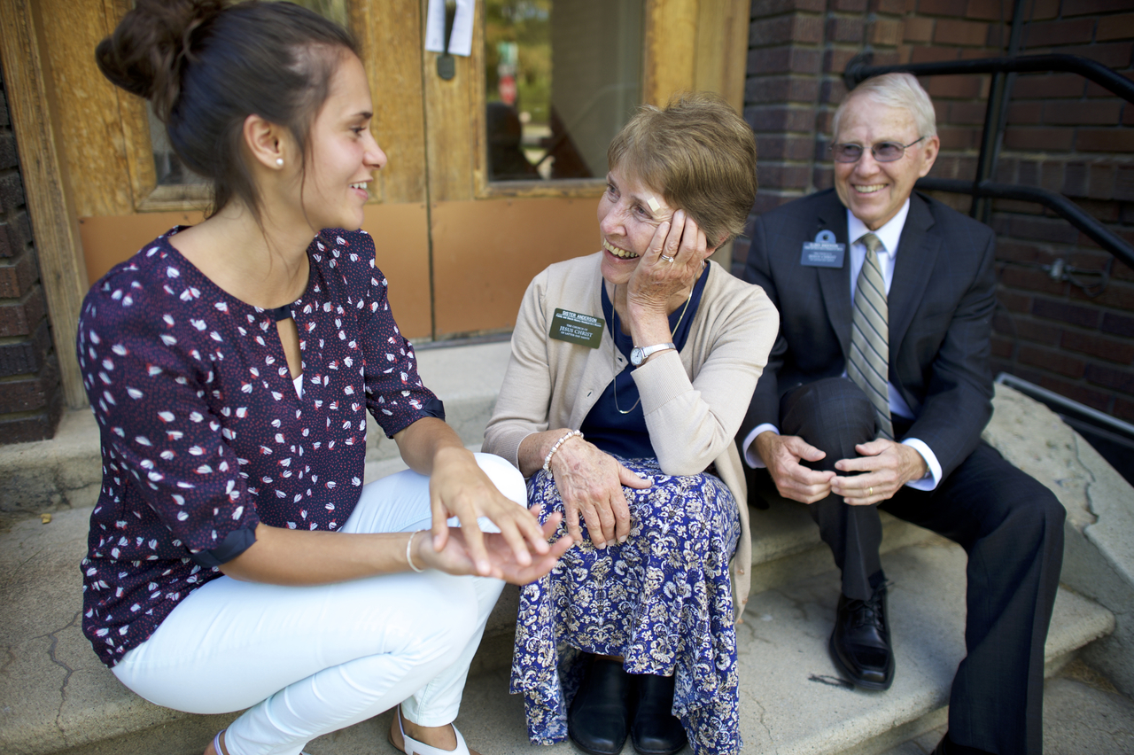 Senior Missionary Couple Talking To A Man 8887