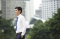 Kuala Lumpur, Selangor, Malaysia: Asian businessman walking outdoors
