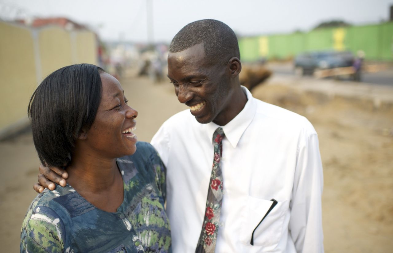 A couple smile together as they contemplate the blessings of marriage