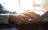 hand being held by two other hands