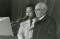 President Spencer W. Kimball speaking at a pulpit with a man next to him translating.