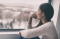 Woman looking outside