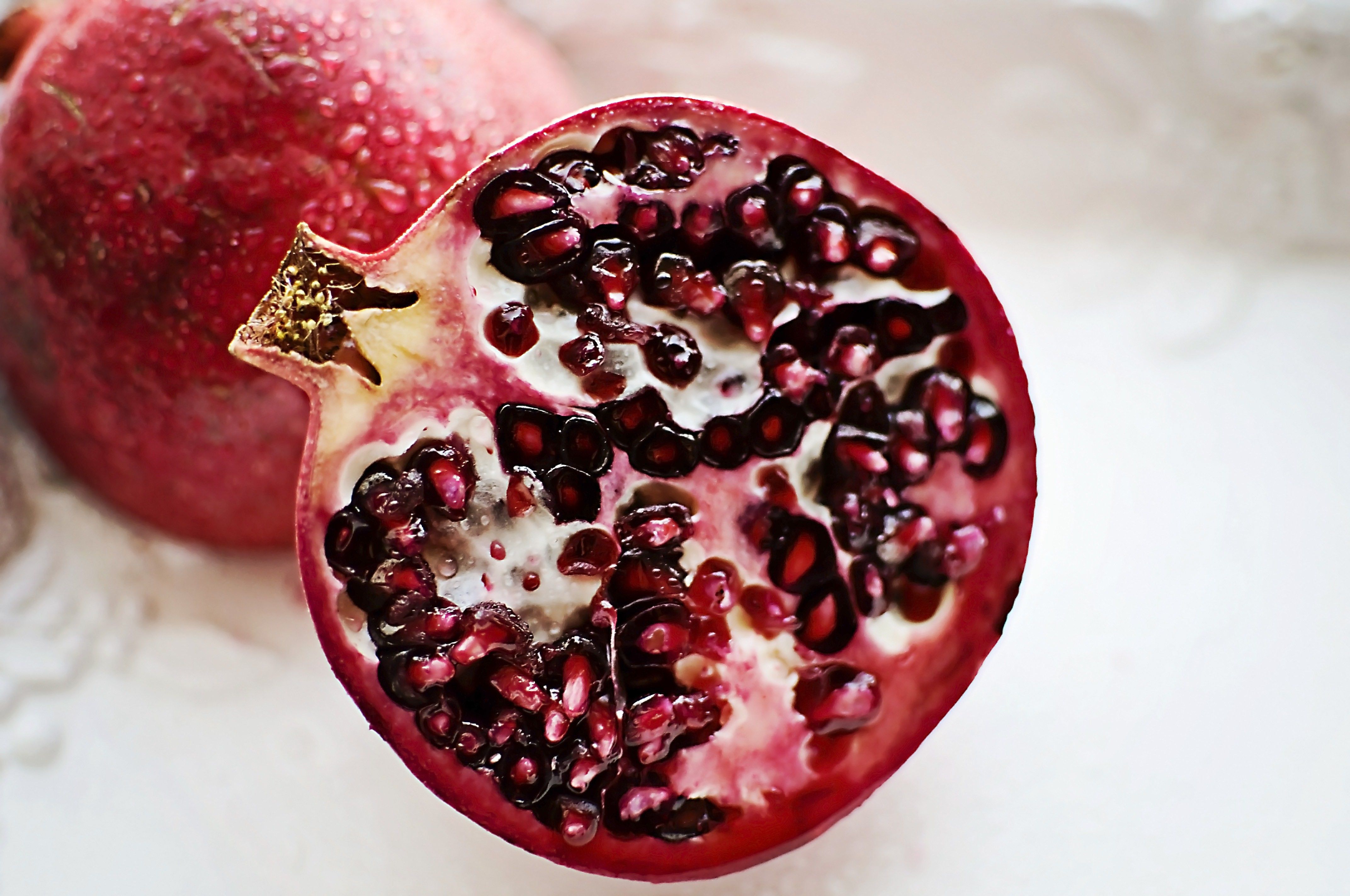 A pomegranate cut in half.