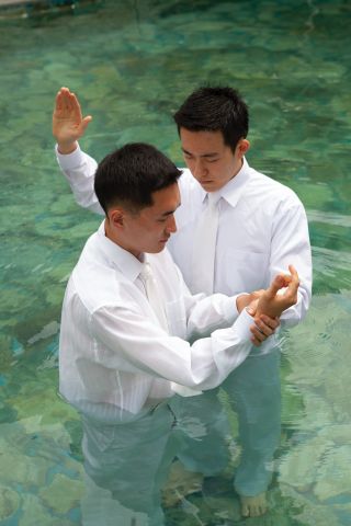 Young Man Being Baptized