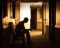 man sitting in chair in the dark