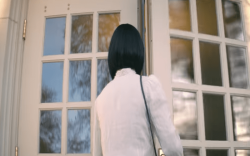 A woman enters a chapel