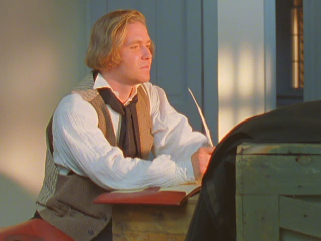 An artist rendition of Joseph Smith writing at a desk