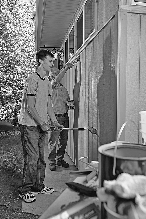 Men painting a building