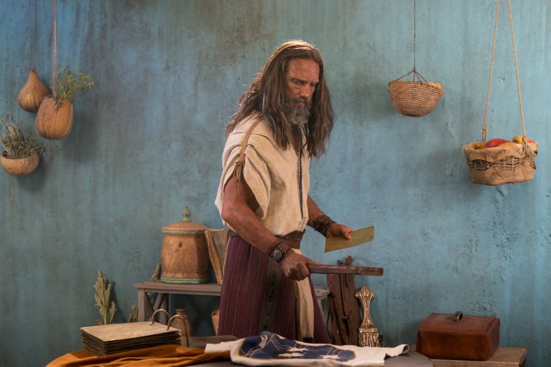 Nephi holding metal plates