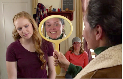 Conversation between a young woman and a leader is difficult when looking into a mirror