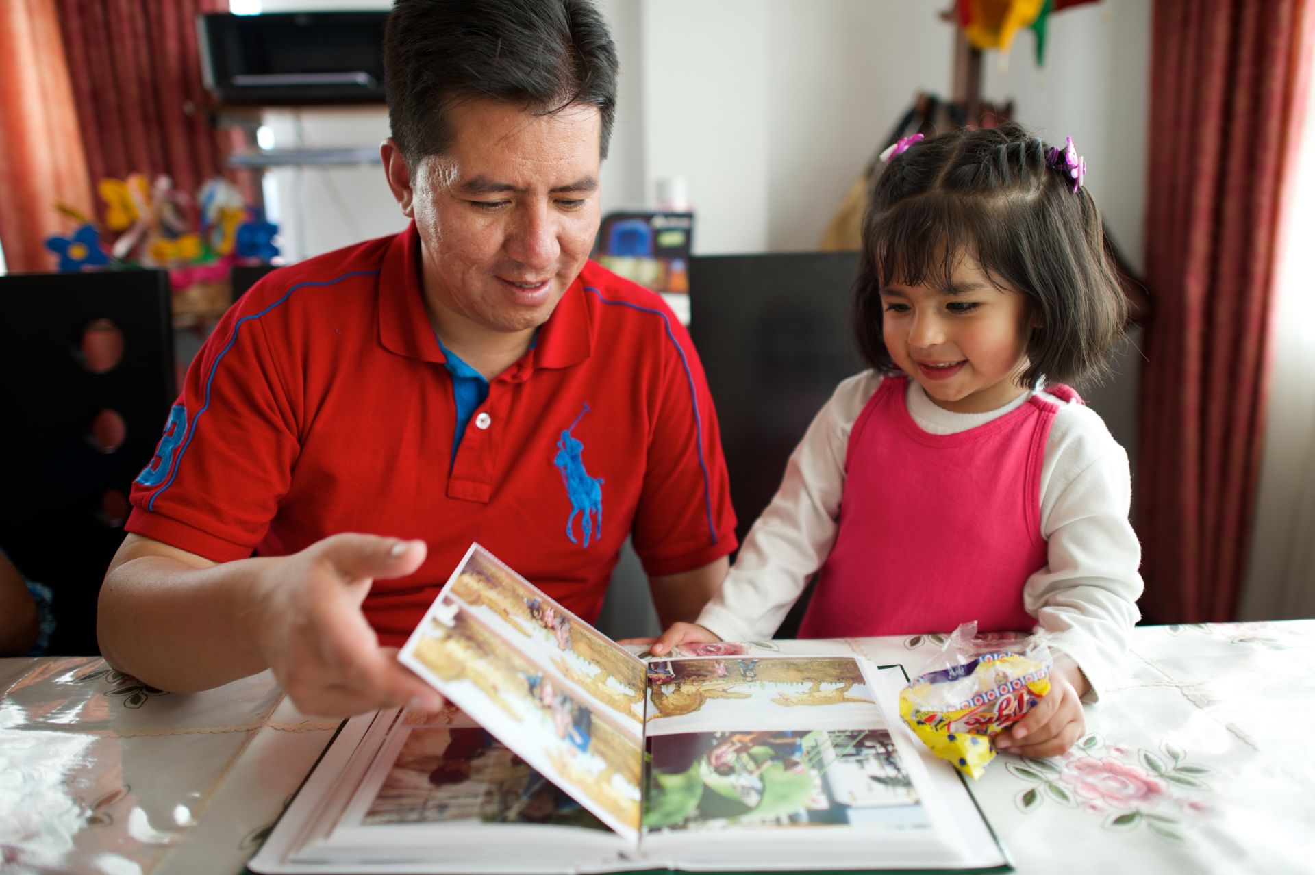 father-and-daughter-looking-at-photos