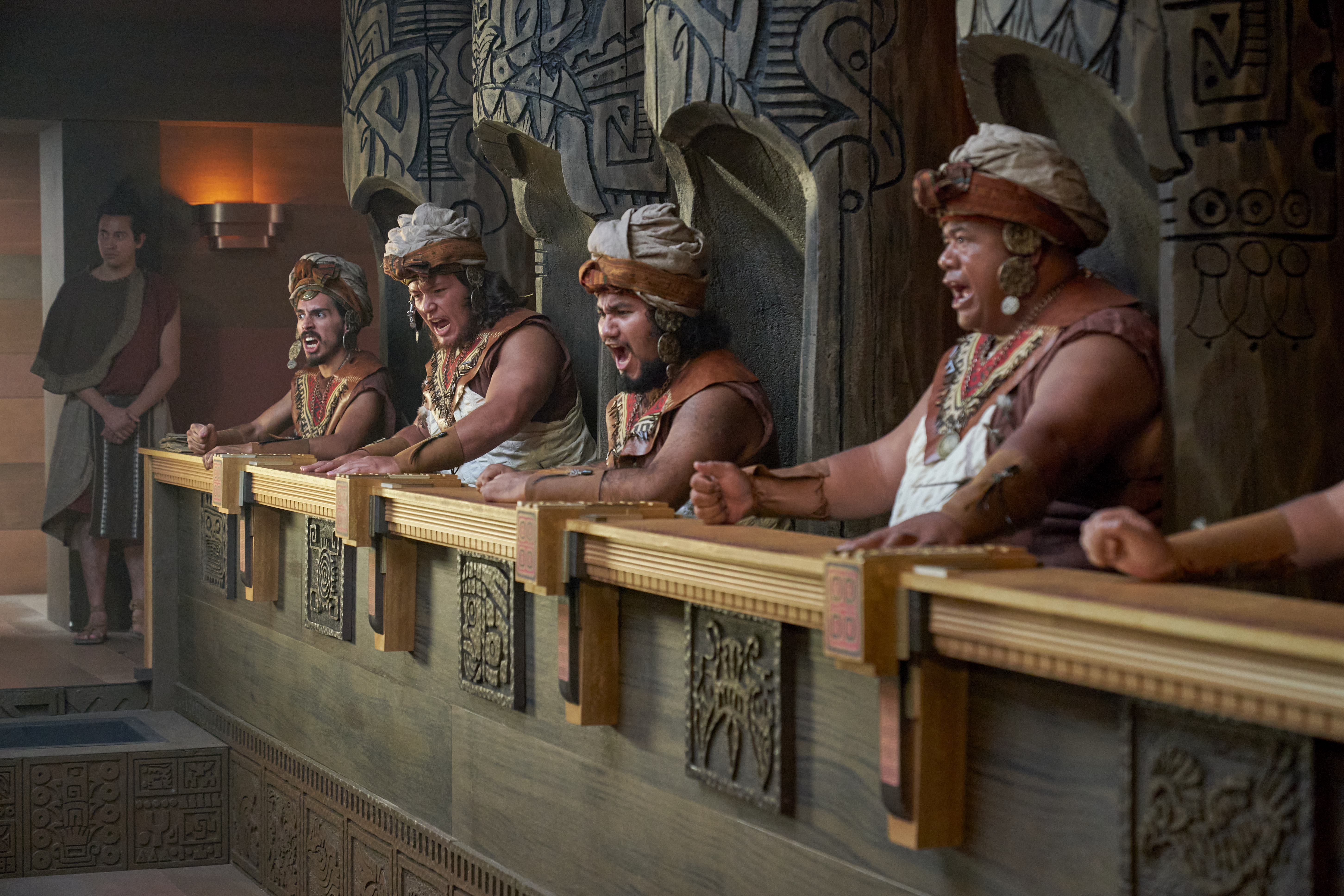 Priests gather around and watch Abinadi being sentenced to death in the court of King Noah.